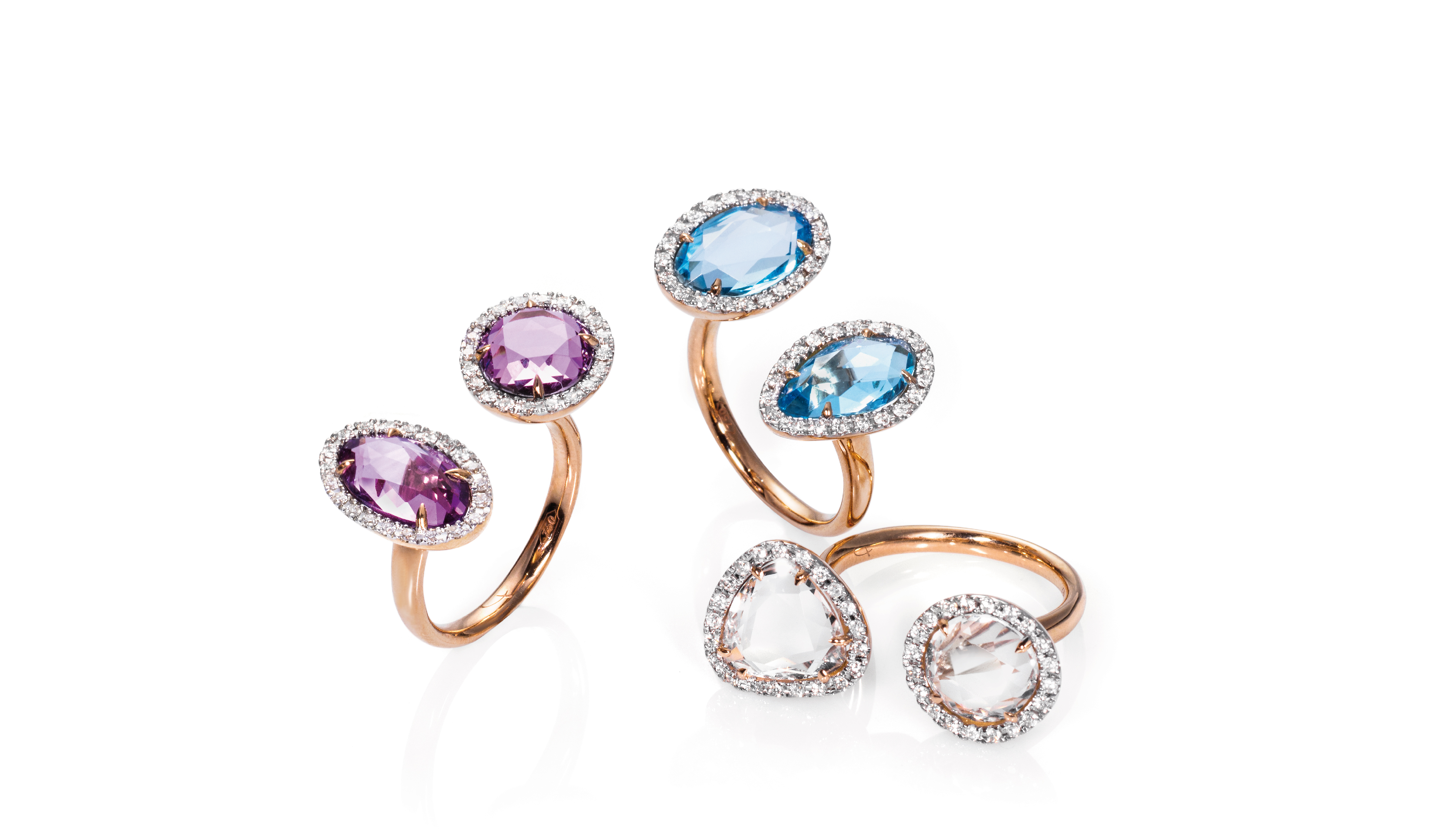 <p>Anelli in oro rosa 18kt con ametista, topazio azzurro, cristallo di rocca e diamanti</p>